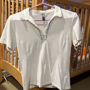 White with light blue trim. Only worn a few times. Zipper in front.